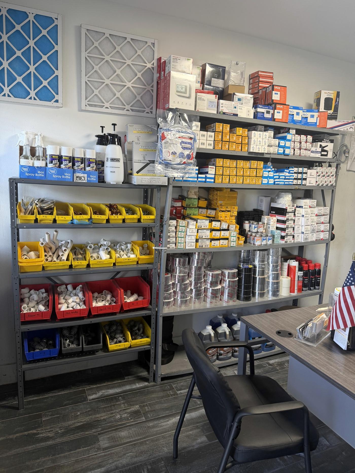 The Banos HVAC Supply parts counter in Hialeah, with bins of HVAC components and small parts on the shelves