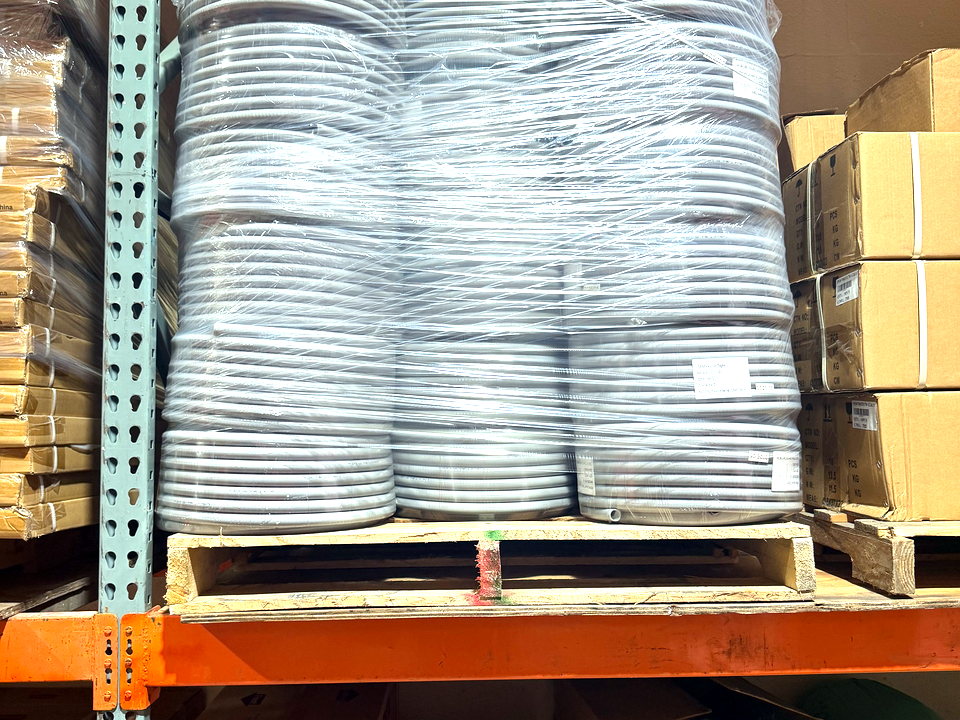 Stacked coils of insulated flexible duct in the Banos HVAC warehouse
