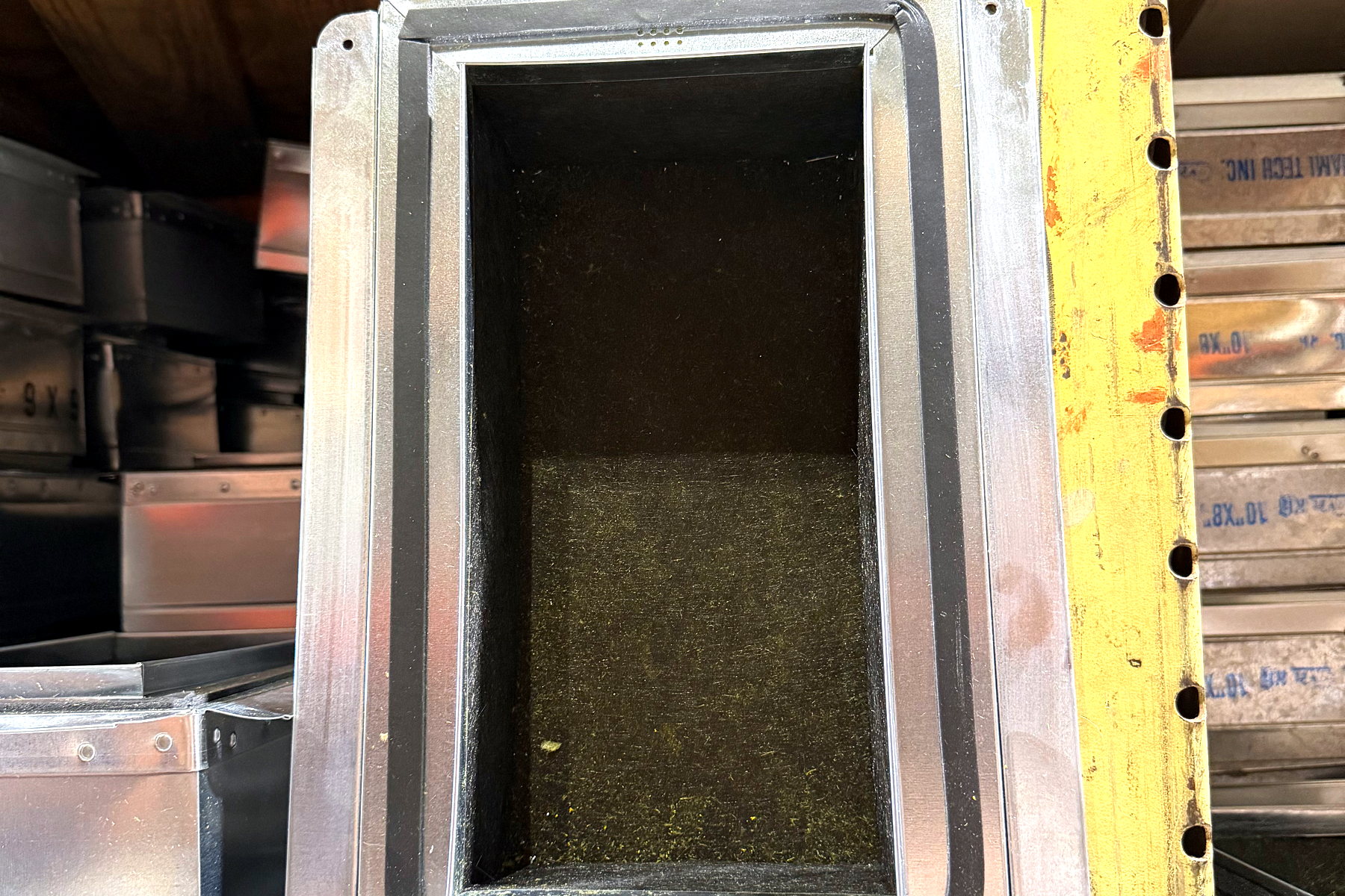 Insulated transition fitting built to order in the Banos HVAC sheet metal shop