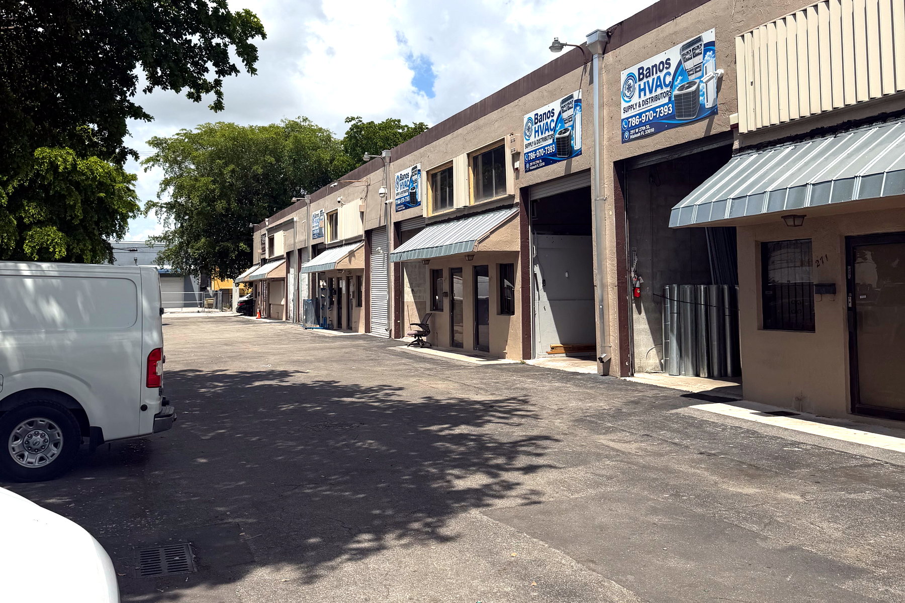 Street view of the Banos HVAC supply house with contractor parking