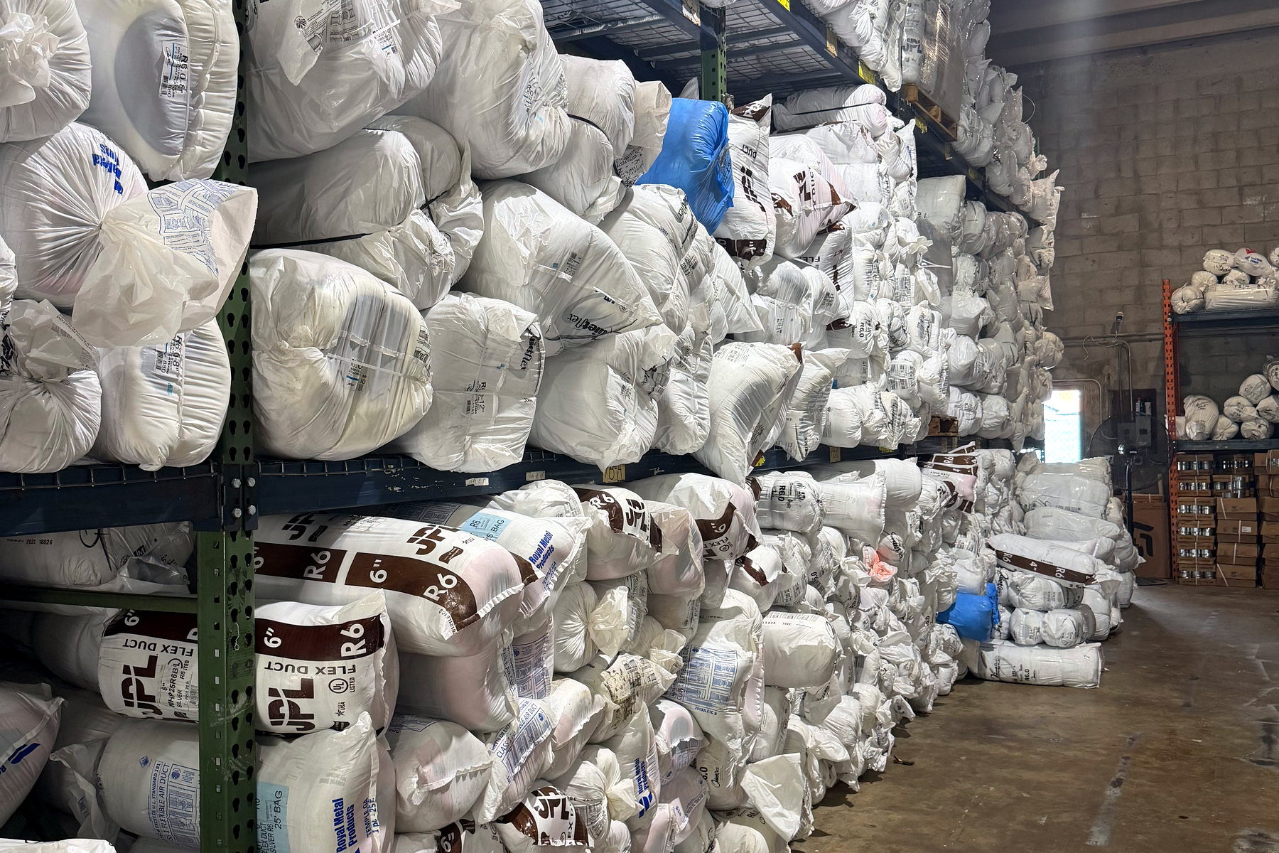 Racking system filled with insulated flexible duct at the Banos HVAC warehouse