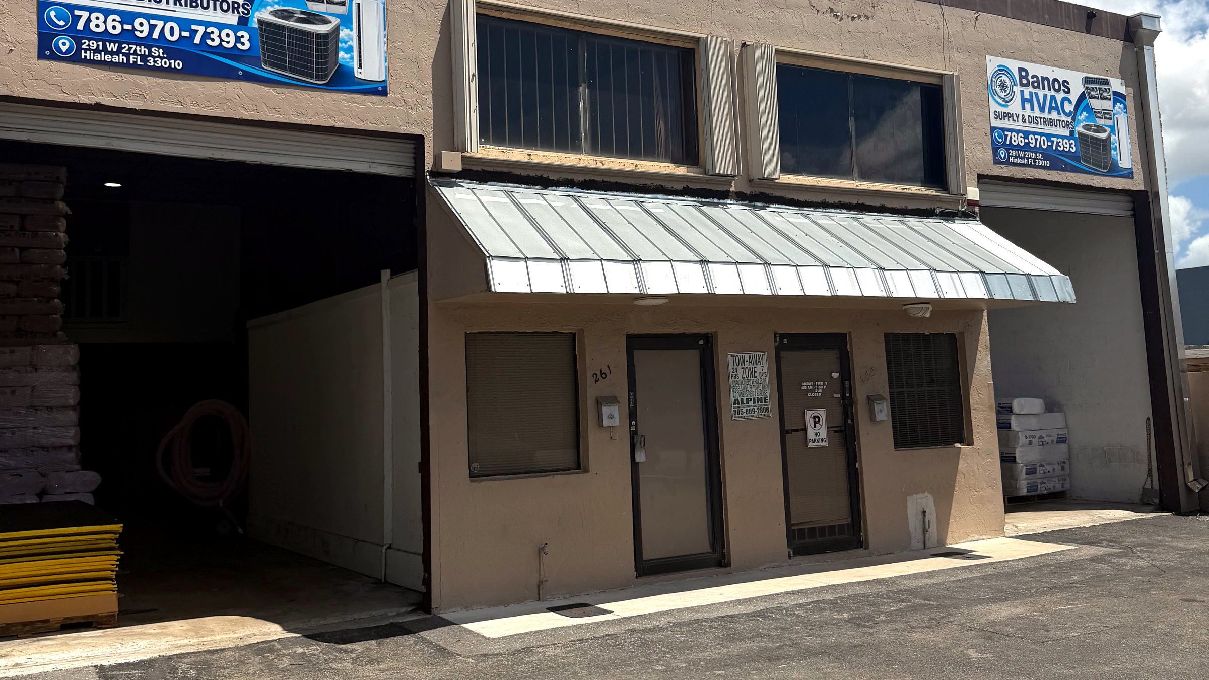 Banos HVAC Supply & Distributors storefront in Hialeah, Florida, with the open warehouse bay and branded signage